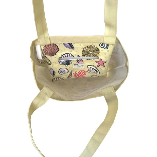 Shells on sand textile tote bag